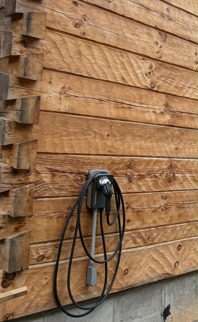 Level 2 EV charger mounted on exterior wall